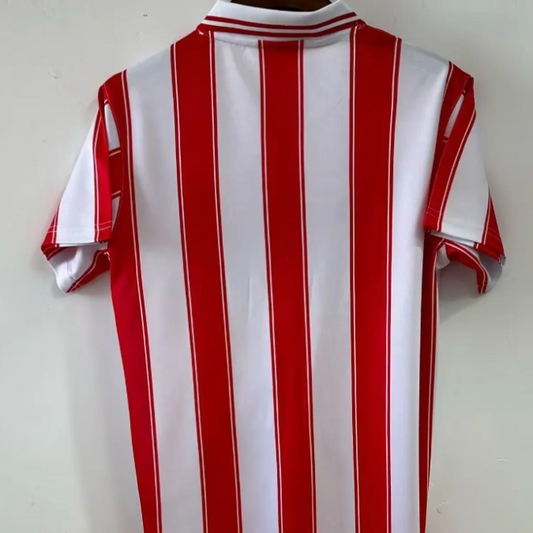 Red and white striped Psv 94/95 home shirt on a plain background