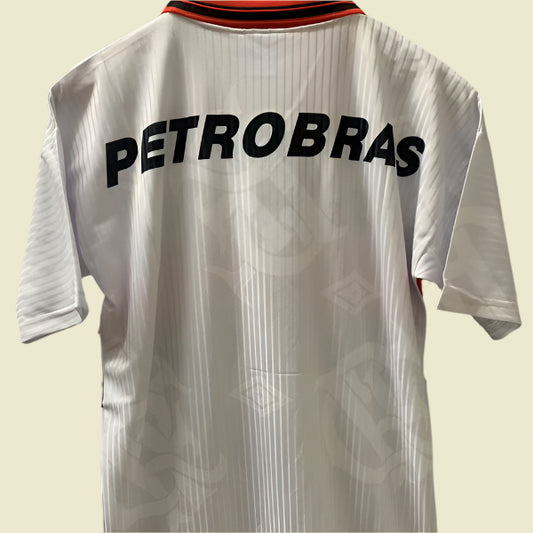 White 1997 Flamengo away shirt with 'PETROBRAS' text on a gray background