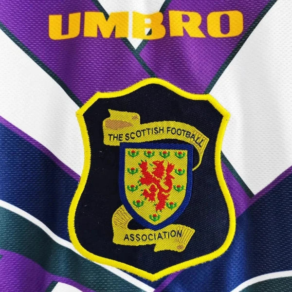 Close-up of a 1994 Scotland away shirt  with 'Umbro' branding and a Scottish football association emblem.