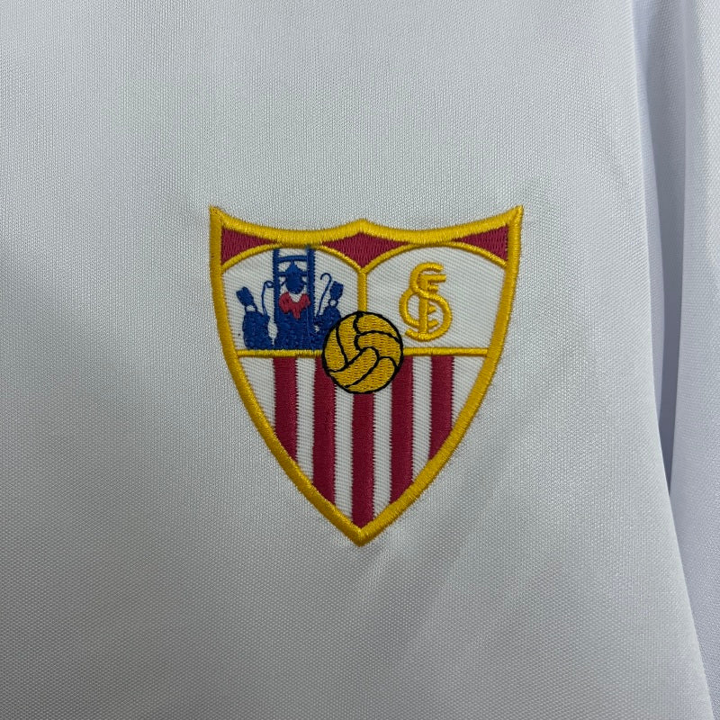 Embroidered logo on a white Sevilla 87-90 home shirt