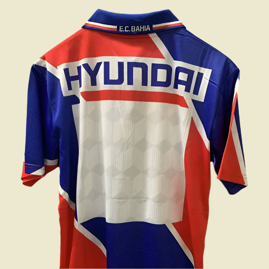 Colorful Bahia 98 away shirt with Hyundai logo on a plain background