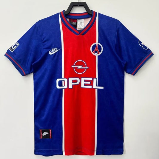 Blue and red psg 95/96 home shirt with Opel logo on a white background