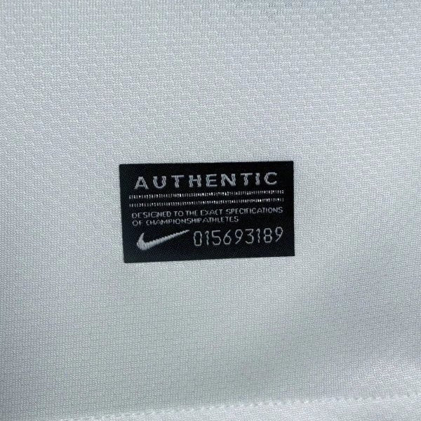 Nike authentic label on a santos 2012 home shirt