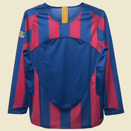 Blue and red striped Barcelona 05/06 champions league shirt on a hanger with a white background