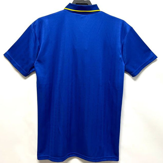 Blue Chelsea 95-97 home shirt on a hanger against a white background