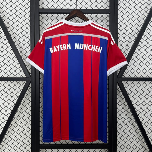 Bayern Munich football jersey on a hanger against a geometric patterned background
