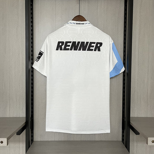 White 95/96 Gremio away shirt with 'RENNER' branding on a hanger against a neutral background