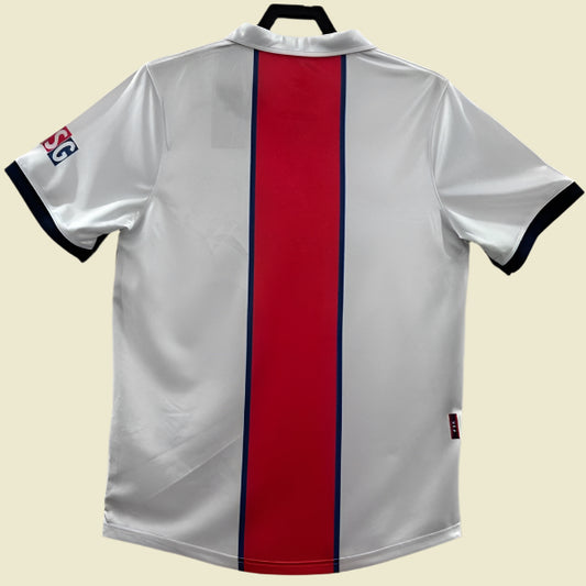 PSG 98/99 away shirt with red and blue stripe on a white background