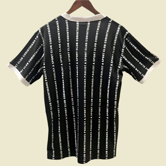 Black Corinthians 1994 third shirt with white text pattern on a gray background