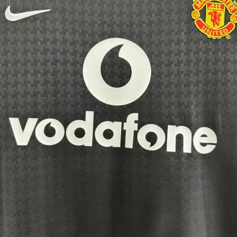 Black man United 03/04 away shirt with Vodafone logo and Manchester United badge