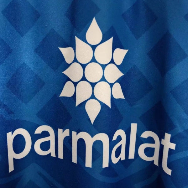 Close-up of a blue Parma 95/96 third Shirt with a white logo and 'parmalat' text