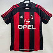 Black and red Ac Milan 00-02 home shirt  with Opel logo on a white background