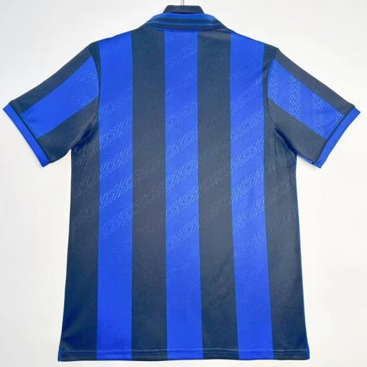Blue and black striped Inter Milan 95/96 home shirt  on a hanger against a white background