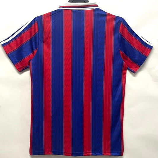 Blue and red striped Bayern Munich 95-97 home shirt on a hanger against a white background