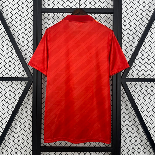 Red Roma 92-94 home shirt on a black and white geometric background