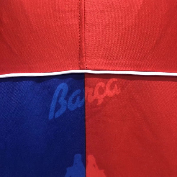 Red and blue Barcelona 92-95 home shirt with 'Barca' branding.