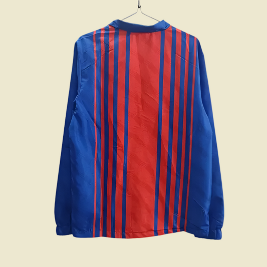 Blue and red striped shirt on a gray background