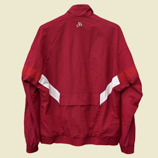 Red Bayern Munich 99-01 windbreaker jacket with white accents on a gray background