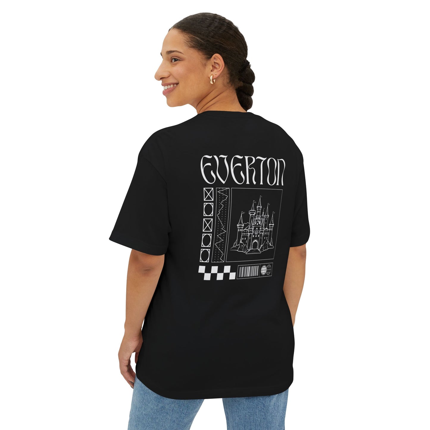 Person wearing a black t-shirt with 'Everton' printed on the back, standing against a white background