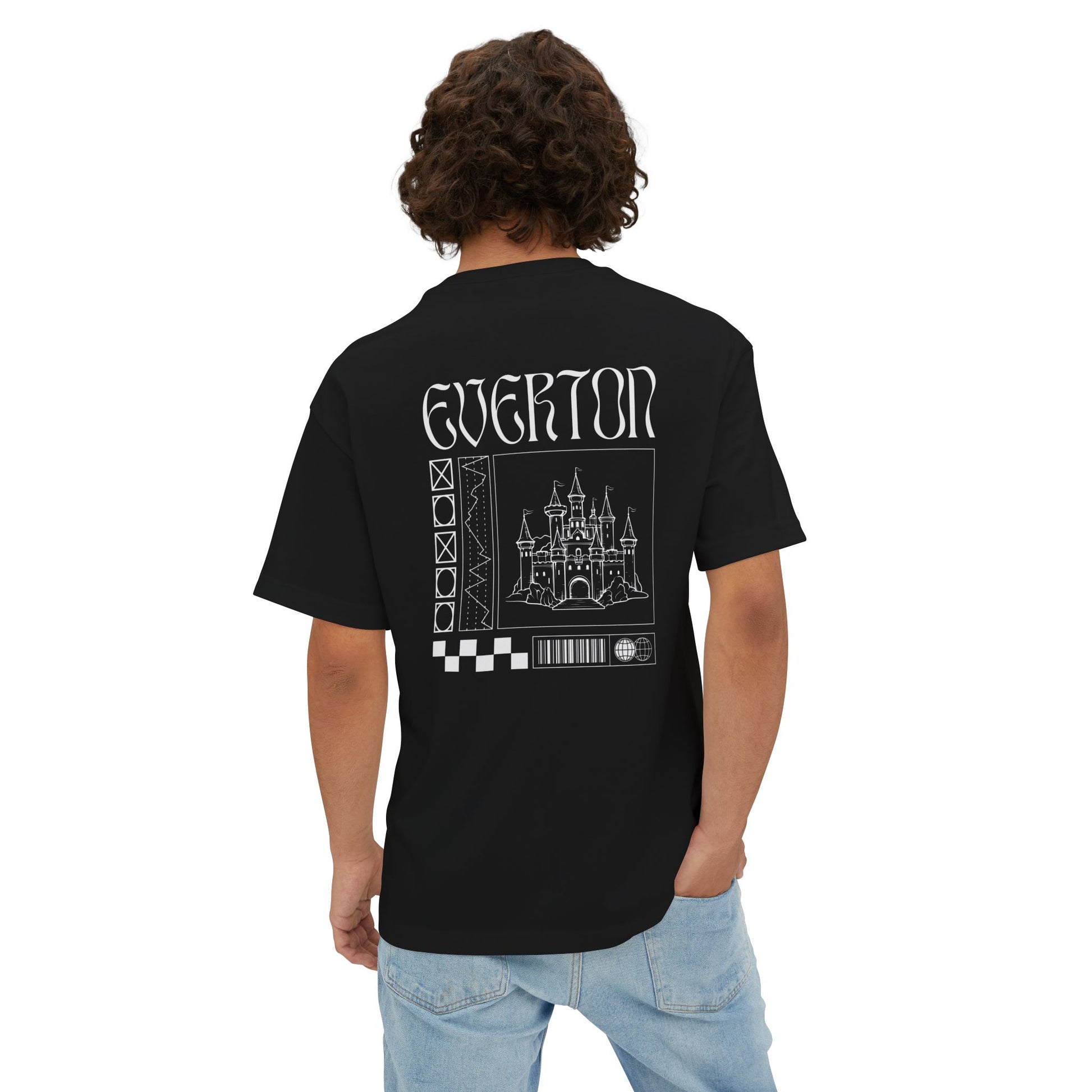Person wearing a black t-shirt with 'Everton' printed on the back, standing against a white background