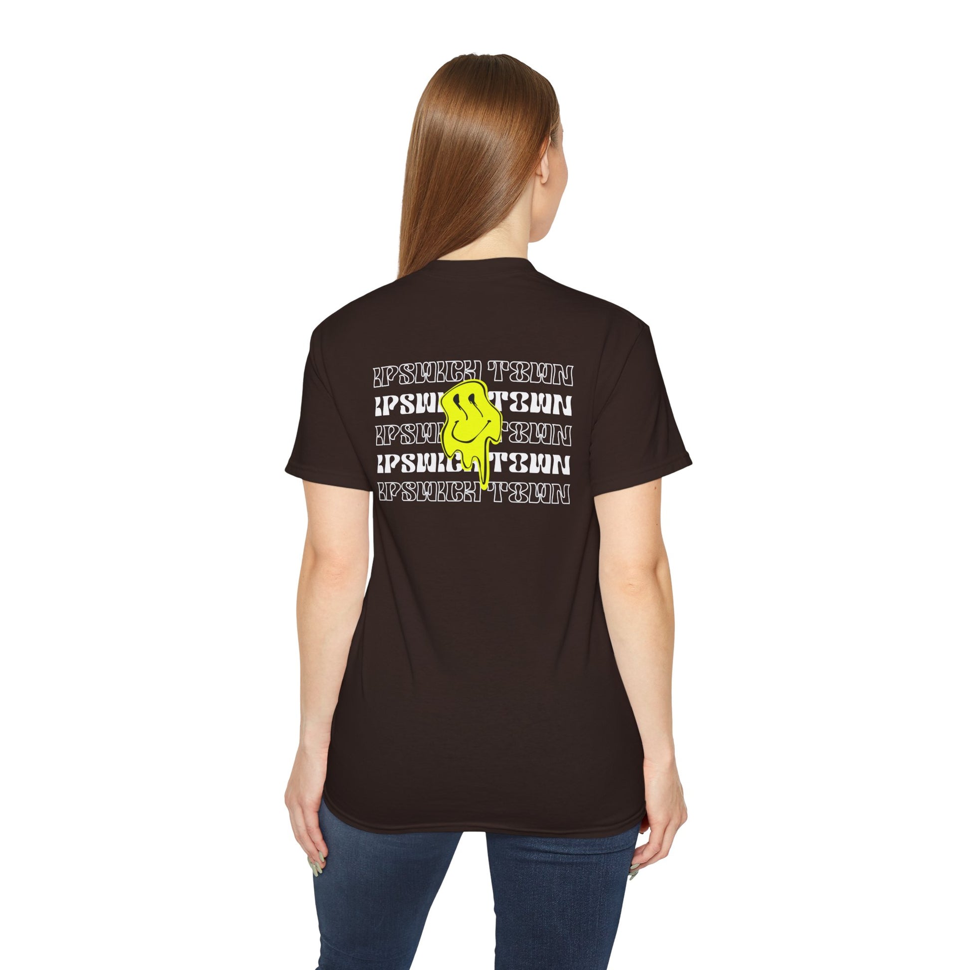 Person wearing a black t-shirt with text and a logo on the back, on a white background