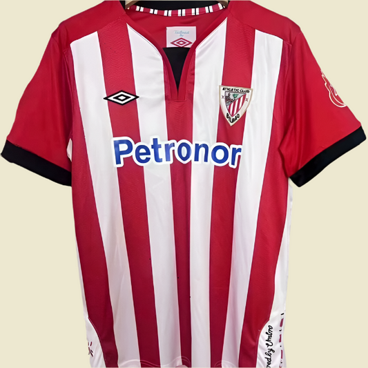 Red and white striped athletic Bilbao 11/12 home shirt with visible branding on a gray backgroud