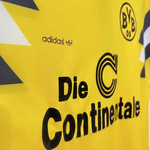 Yellow 1988 Borussia Dortmund dfb-pokal final football shirt with Adidas and Continental logos on a yellow background