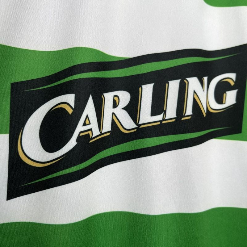Carling logo on a green and white striped Celtic 05/06 home shirt