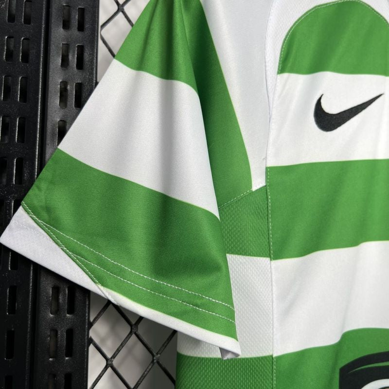 Green and white Celtic 05/06 home shirt with Nike logo on a black metal surface