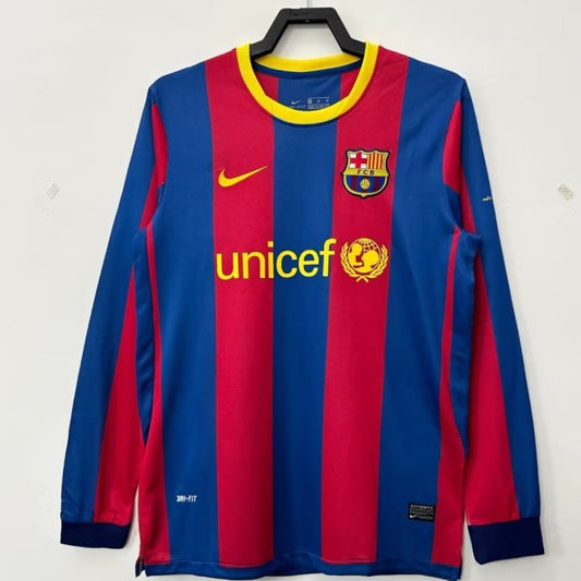 Barcelona 10/11 home football jersey with Nike and UNICEF logos on a hanger against a white background