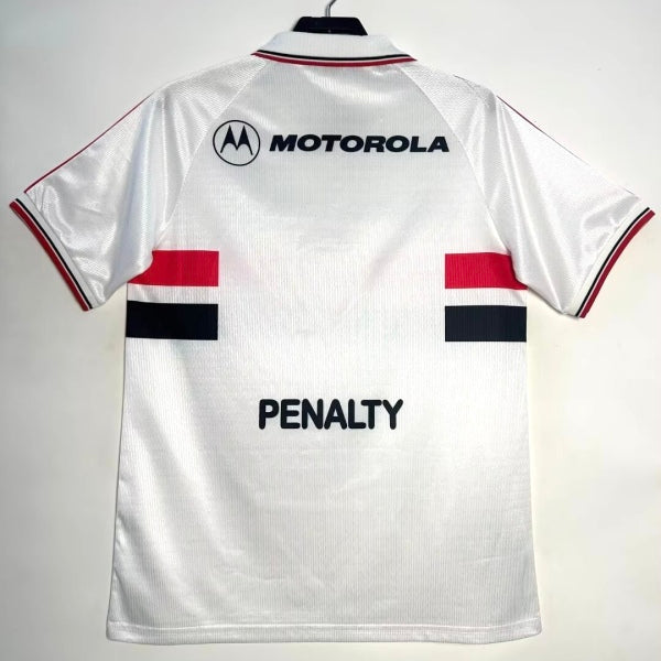 White 2000 São Paulo home shirt with Motorola and Penalty branding on a hanger against a white background