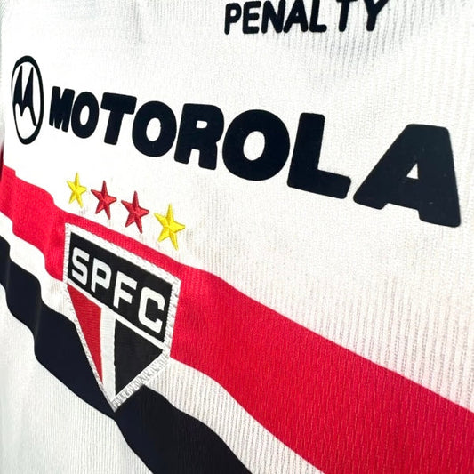 Close-up of a 2000 São Paulo home shirt with 'Penalty' and 'Motorola' logos on a white background.