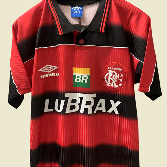 Red and black 1997 Flamengo home shirt with visible branding on a gray background