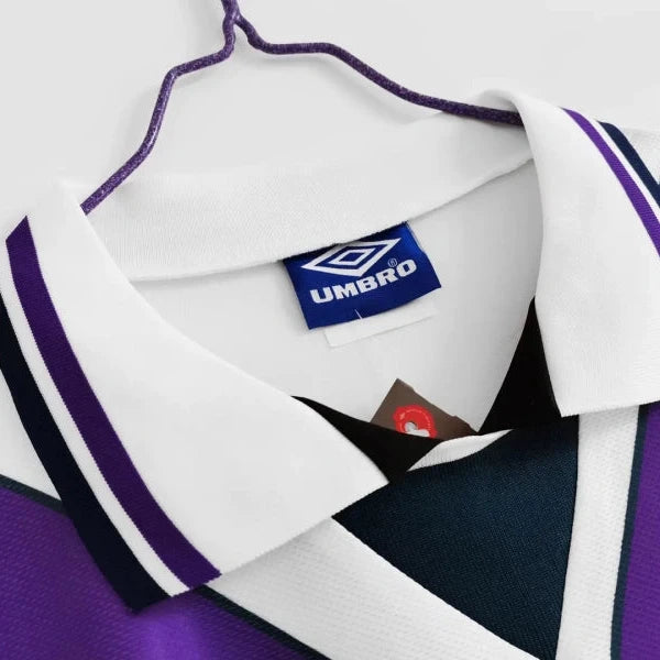 Purple and white 1994 Scotland away shirt  with Umbro logo on a white background