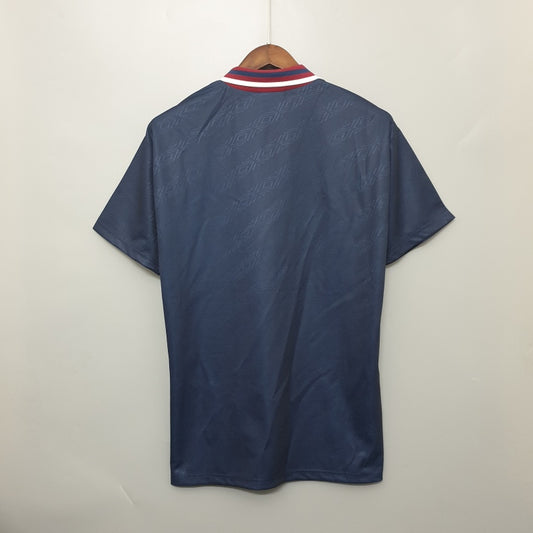 Navy blue Ajax 94/95 away shirt on a hanger against a white background
