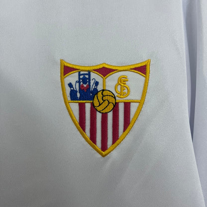 Embroidered logo on a white Sevilla 87-90 home shirt