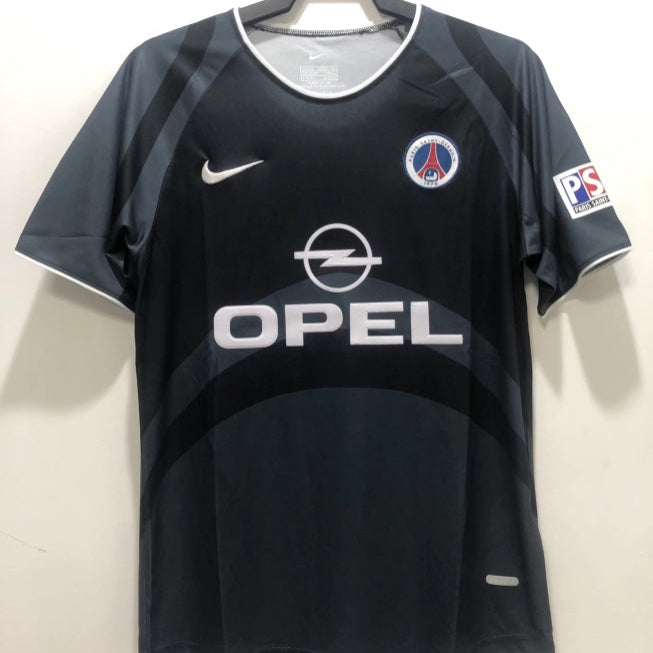 Black 00/01 psg third shirt with Opel logo on a hanger against a white background