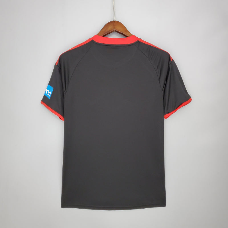 Benfica 09/10 away shirt with red accents on a hanger against a gray background