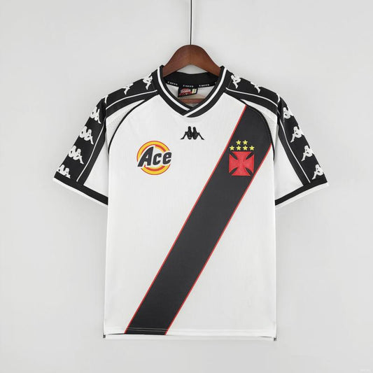 White Vasco de gama 2000 away shirt with black and red accents on a hanger against a white background