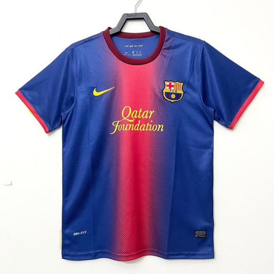 Blue and red Barcelona 12/13 home shirt  with Nike logo on a white background