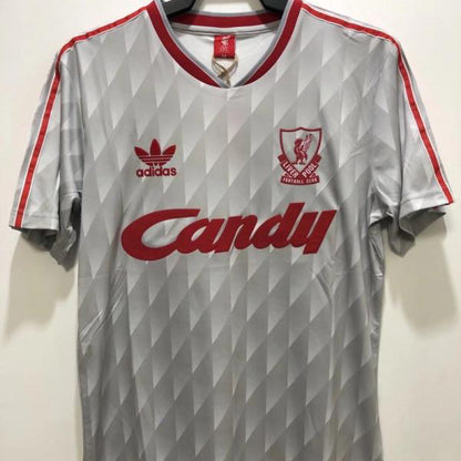 Gray Liverpool 89-91 away shirt with red accents and visible branding on a hanger against a white background