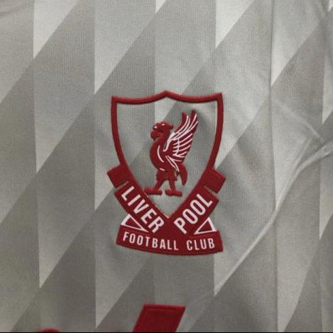 Gray Liverpool 89-91 away shirt with red accents and Liverpool Football Club logo