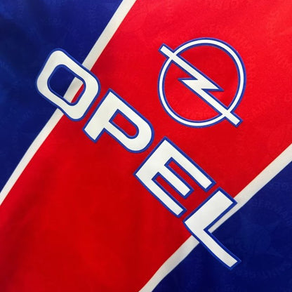 Opel logo on a red and blue psg 95/96 home shirt