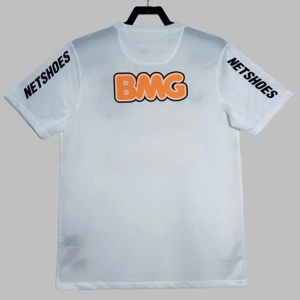 White santos 2012 home shirt with 'BMG' in orange and 'NETSHOES' in black on a gray background