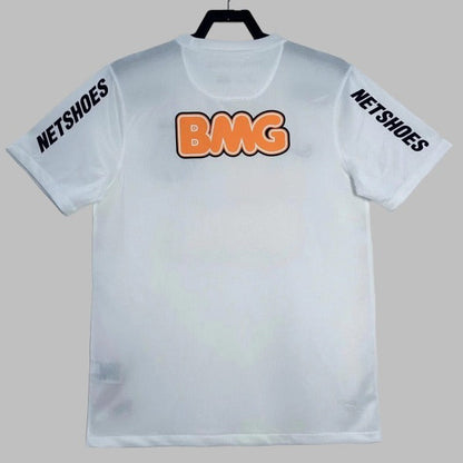 White santos 2012 home shirt with 'BMG' in orange and 'NETSHOES' in black on a gray background