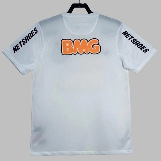 White santos 2012 home shirt with 'BMG' in orange and 'NETSHOES' in black on a gray background
