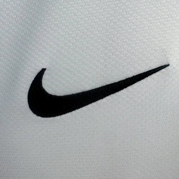 Black Nike logo on a santos 2012 home shirt
