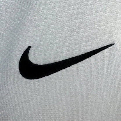 Black Nike logo on a santos 2012 home shirt