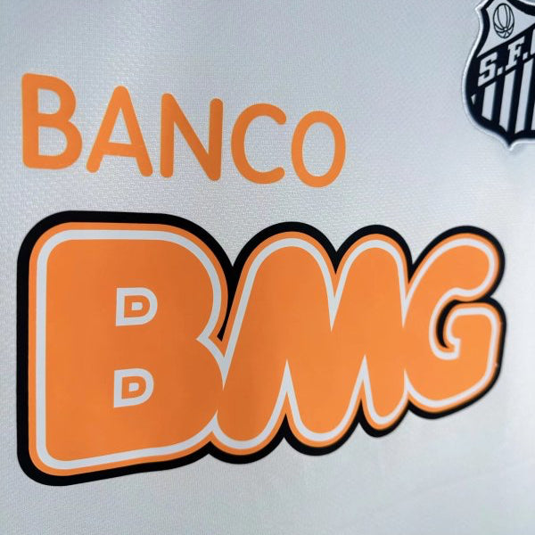 Close-up of a santos 2012 home shirt with 'Banco Bmg' logo on a white background