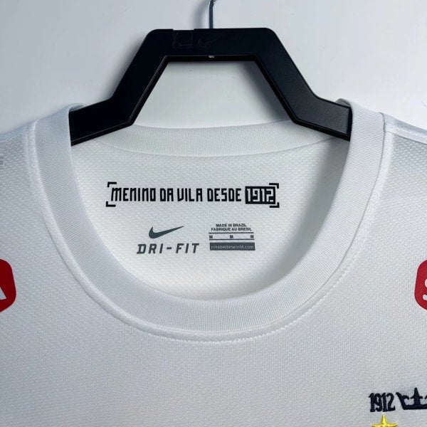 White santos 2012 home shirt with Nike branding on a hanger against a white background